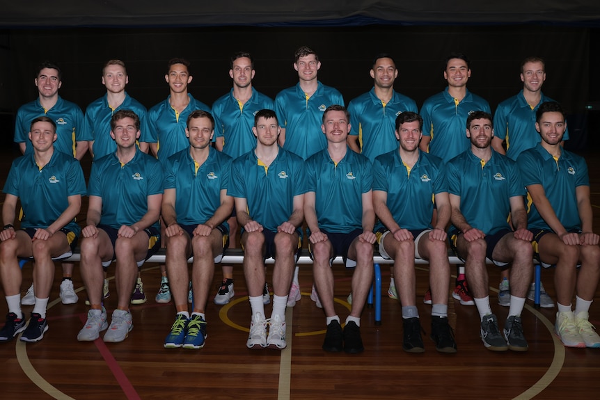 16 players from the Australian Opens Mens Netball pose for a photo