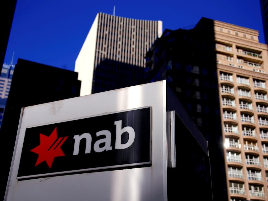 The logo of the National Australia Bank is displayed outside their headquarters building in central Sydney.