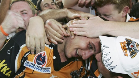 Robbie Farah celebrates with Tigers fans after the NRL grand final