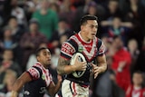 Sonny Bill Williams in the clear running with the ball against Manly in the 2013 NRL grand final.