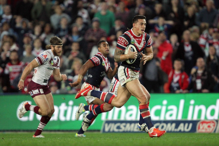 Sydney Roosters player Sonny Bill Williams runs with the ball against the Manly Sea Eagles.