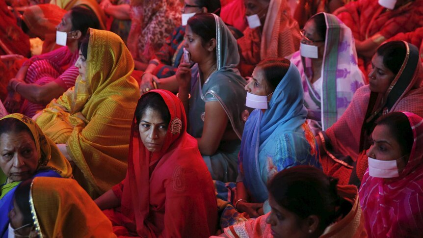 Women pray for the souls of the earthquake victims in Nepal