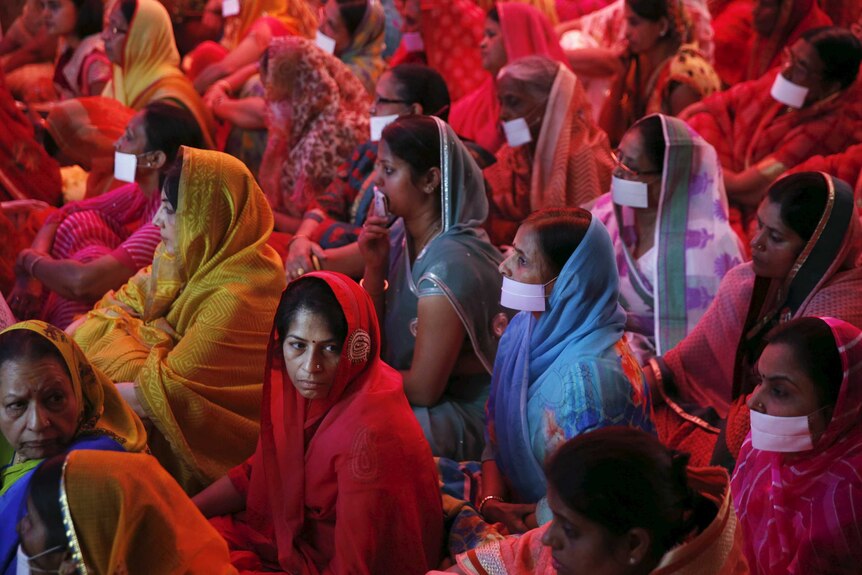 Women pray for the souls of the earthquake victims in Nepal