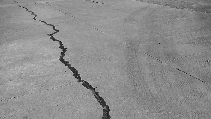 A large crack running along the ground