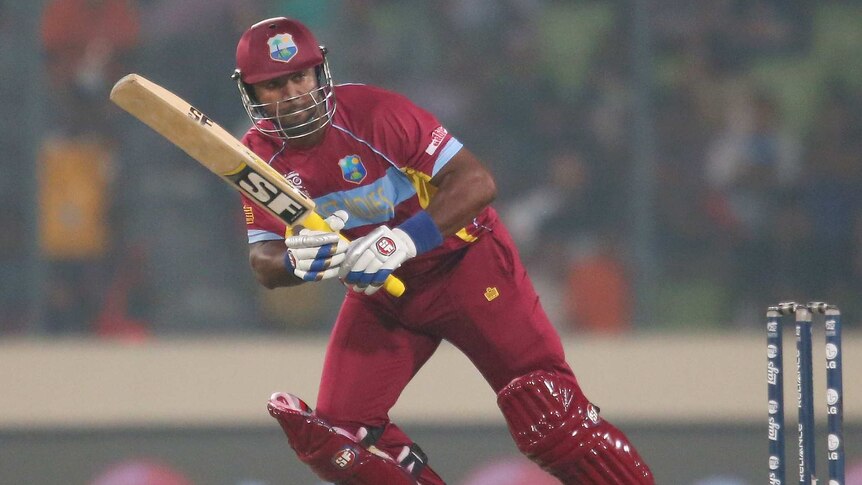 Hunt for runs ... Dwayne Smith hits a boundary for West indies