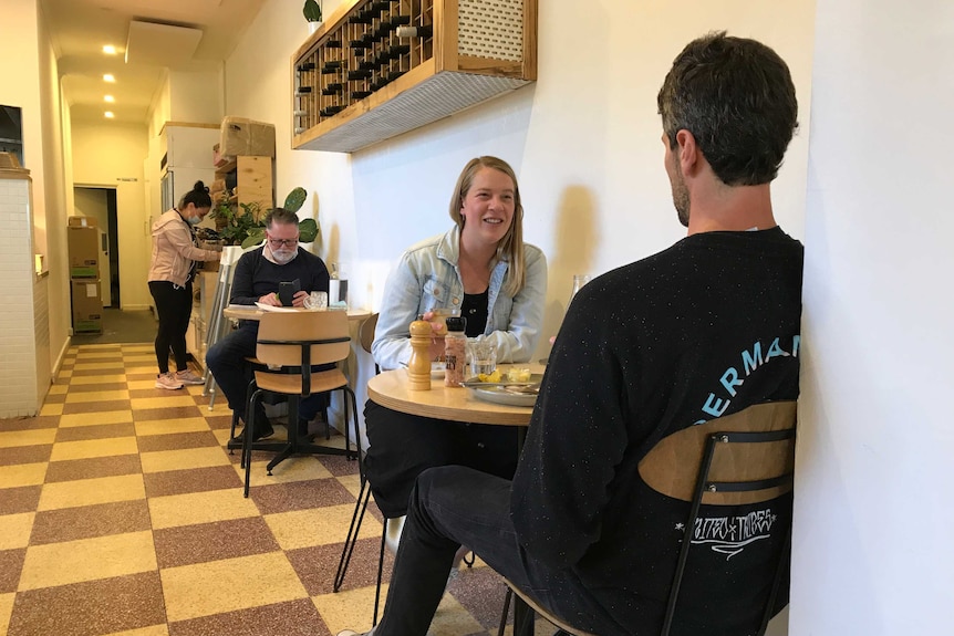 A photo of people sitting inside in a Melbourne cafe.