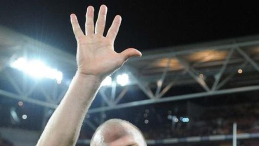 High five: Queensland captain Darren Lockyer celebrates a fifth straight Origin series victory.