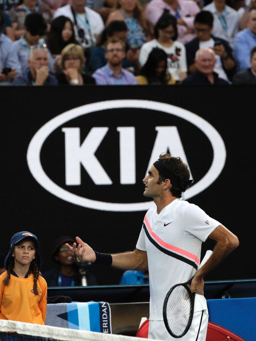 Switzerland's Roger Federer argues with chair umpire Fergus Murphy at the Australian Open.