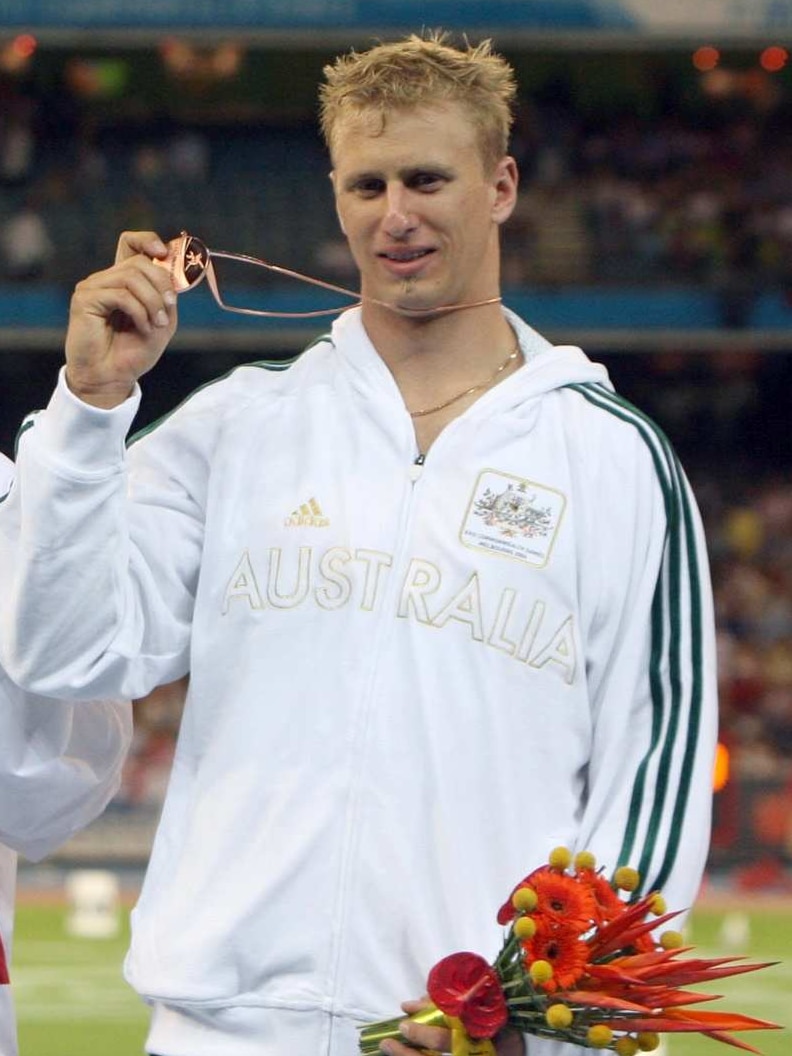 Commonwealth medalist and javelin thrower Oliver Dziubak poses during the medal ceremony at the Melbourne Commonwealth Games