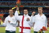 Commonwealth medalist and javelin thrower Oliver Dziubak poses during the medal ceremony at the Melbourne Commonwealth Games