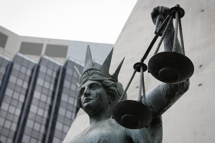 Lady of justice statue outside Brisbane's Supreme and District Courts buildings.