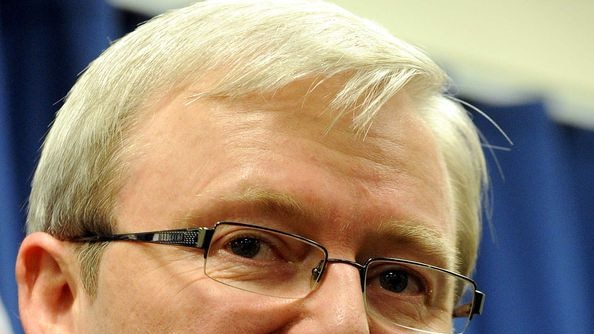 Former prime minister Kevin Rudd gestures during a press conference