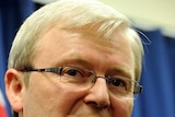 Former prime minister Kevin Rudd gestures during a press conference