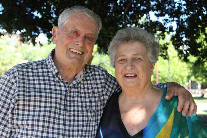 John and Bev Lowe stand arm in arm.