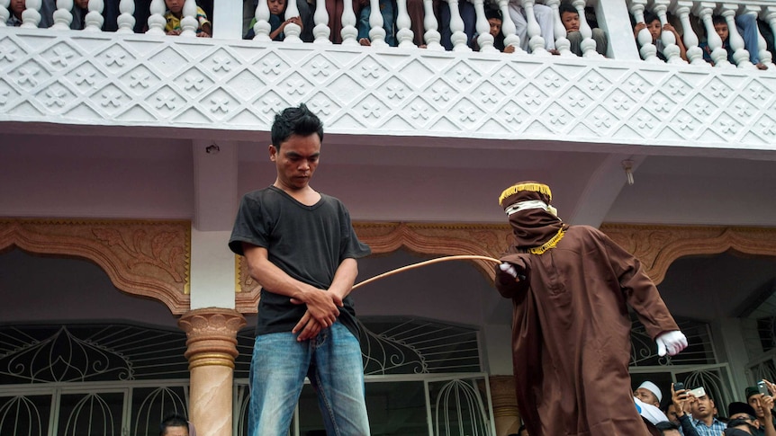 Man suffers public caning in Aceh