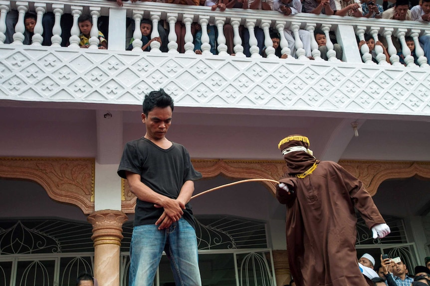 Man suffers public caning in Aceh