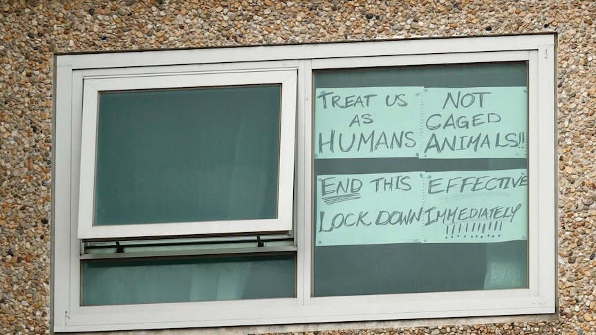 A sign in a window of the Flemington Towers Government Housing complex in Melbourne.