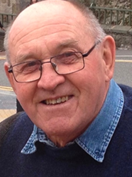 A man in glasses and a jumper.