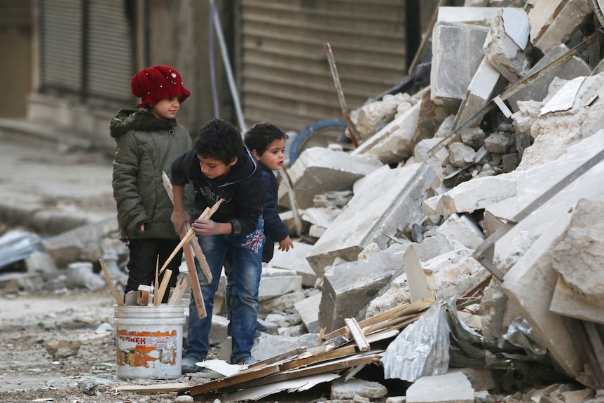 Children collect firewood in eastern Aleppo