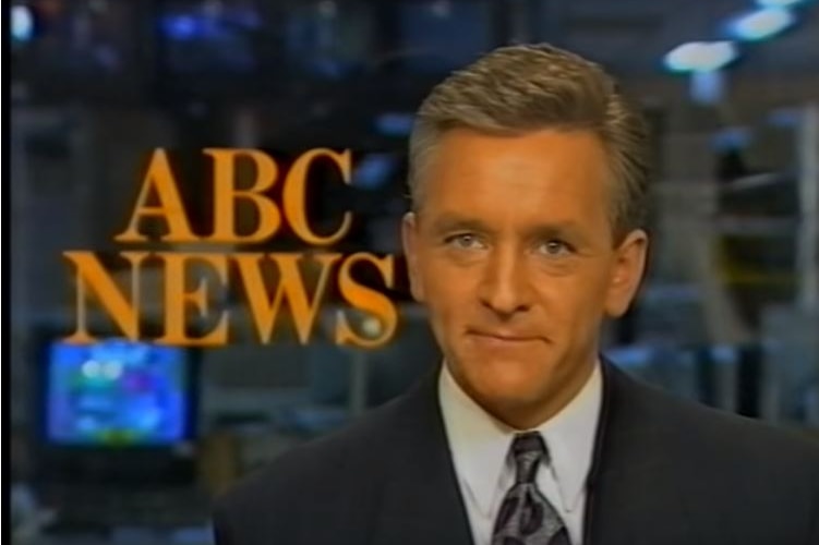 Ian Henderson sits at the ABC News desk.