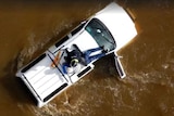 Police prepare to winch a 79yo man out of floodwaters in northern Tasmania, November 13, 2016.