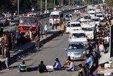 A line of traffic grows as members of India's Jat community block a major highway