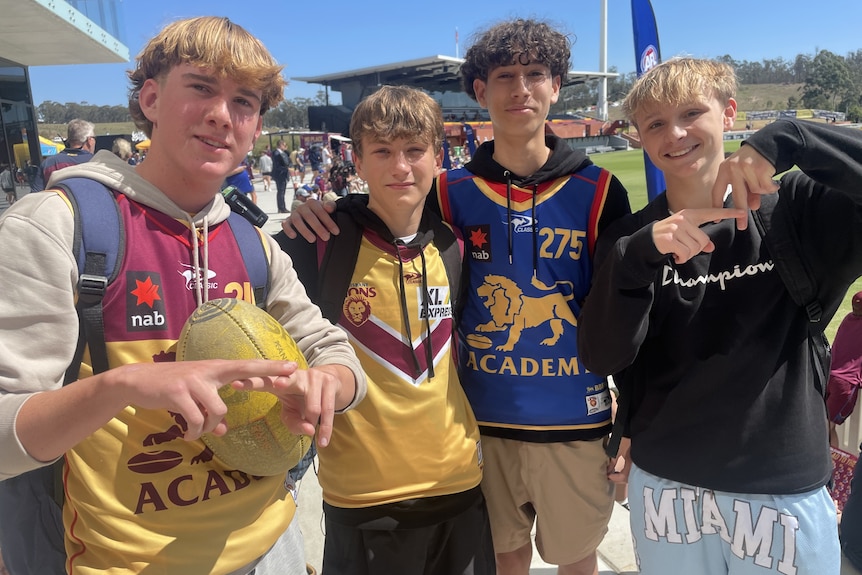 A group of teen boys wearing Lions merch