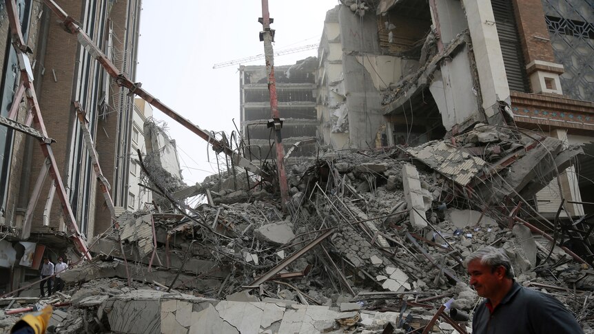 Rubble is piled high after a 10-storey building collapse