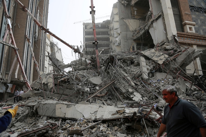 Rubble is piled high after a 10-storey building collapse