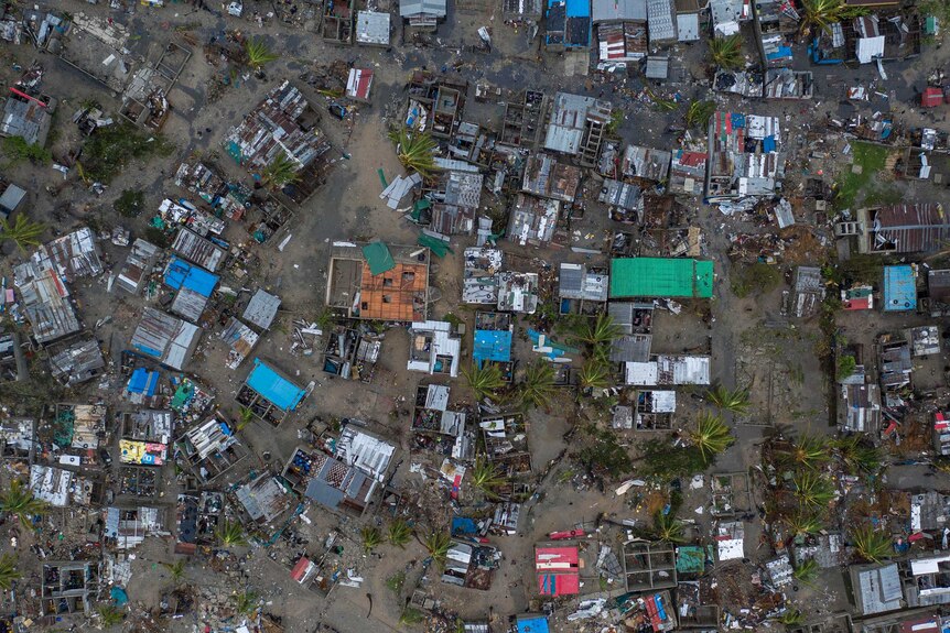 From a bird's eye view, you see informal village grids decimated with flood waters seeping between homes without roofs.