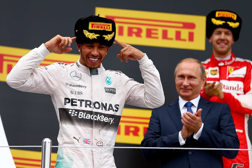 Lewis Hamilton celebrates Russian GP win as Vladimir Putin looks on