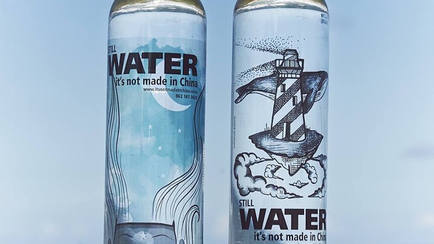 Two bottles of water with the labels "Still water. It's not made in China".