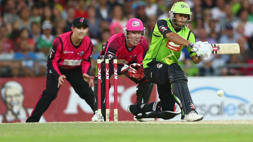 Usman Khawaja bats for the Sydney Thunder against the Sydney Sixers in the Big Bash.