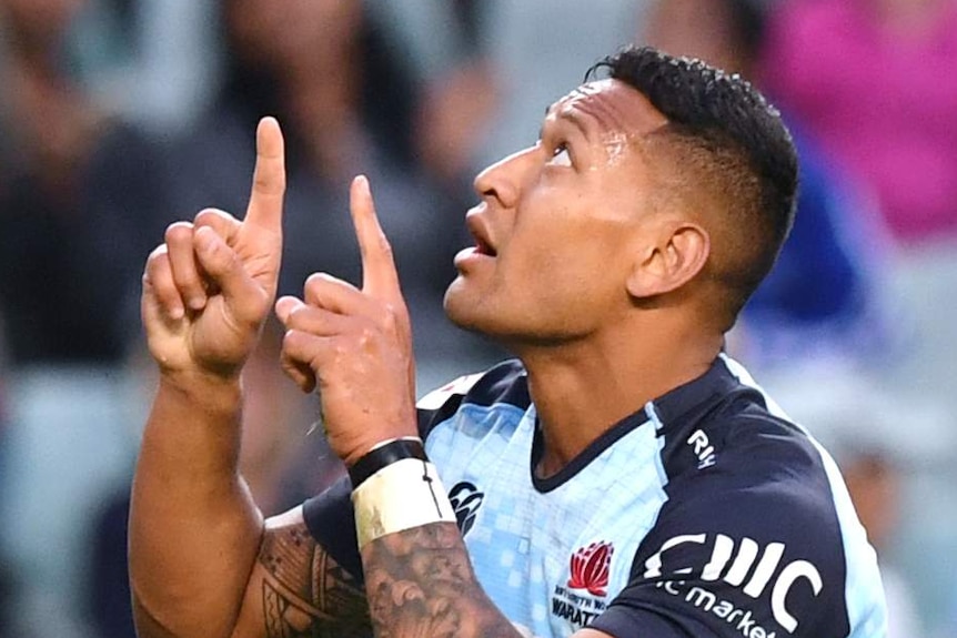 Israel Folau looks and points to the sky after scoring a Super Rugby try for the NSW Waratahs.