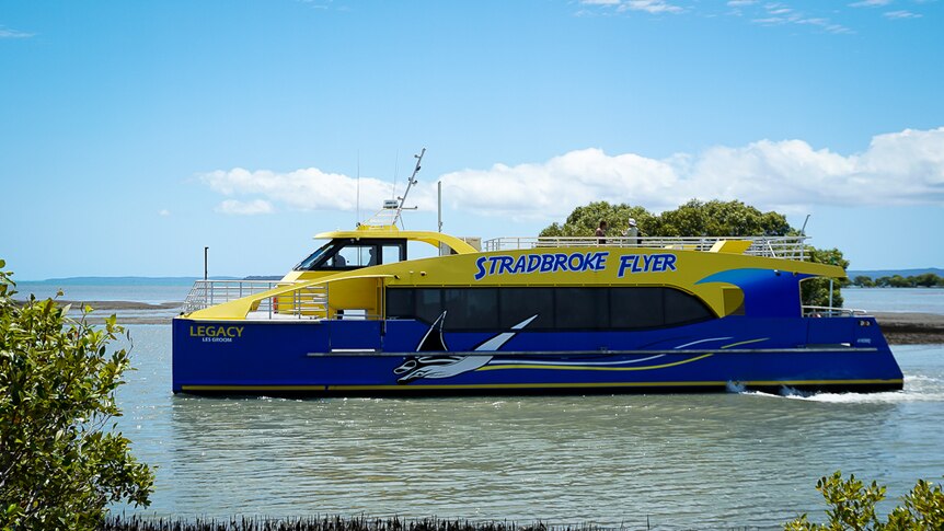 The 'Stradbroke Flyer' ferry in the water, with trees in the background.
