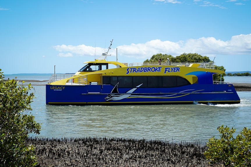 The 'Stradbroke Flyer' ferry in the water, with trees in the background.