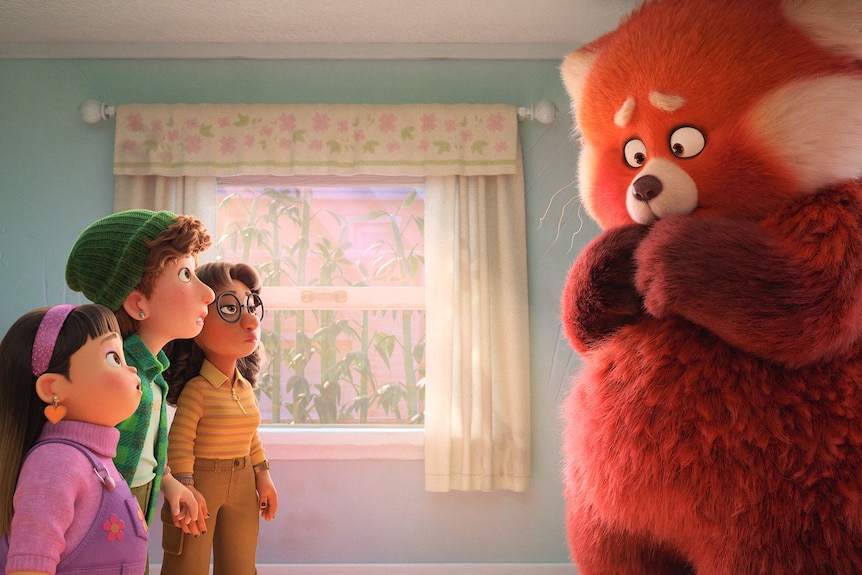 Three animated teen girls wearing pink, green and yellow respectively stand looking bewildered at a large shy red panda