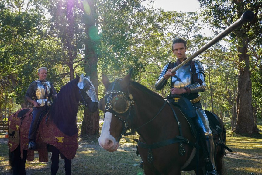 Two men on horseback in armour.