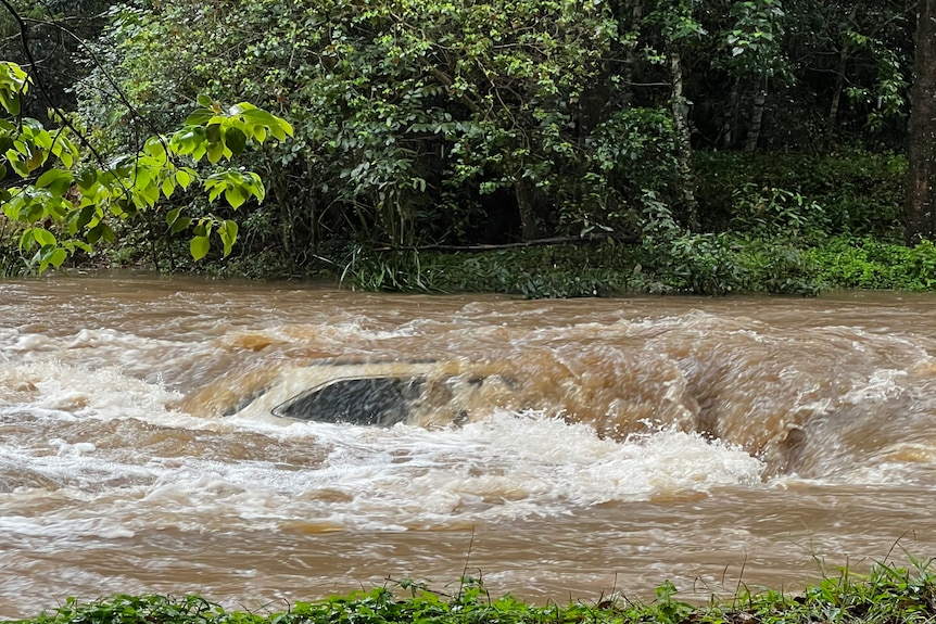 A car almost totally underwater