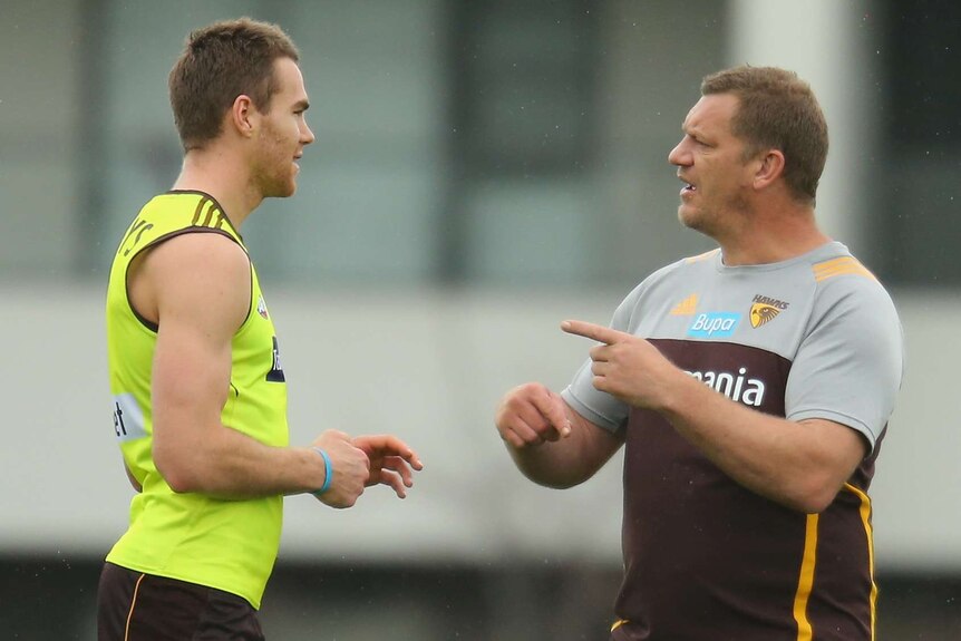 Max Bailey talks to Damian Monkhorst at Hawks training