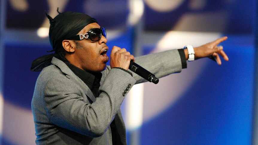 Singer Coolio performs before a panel discussion