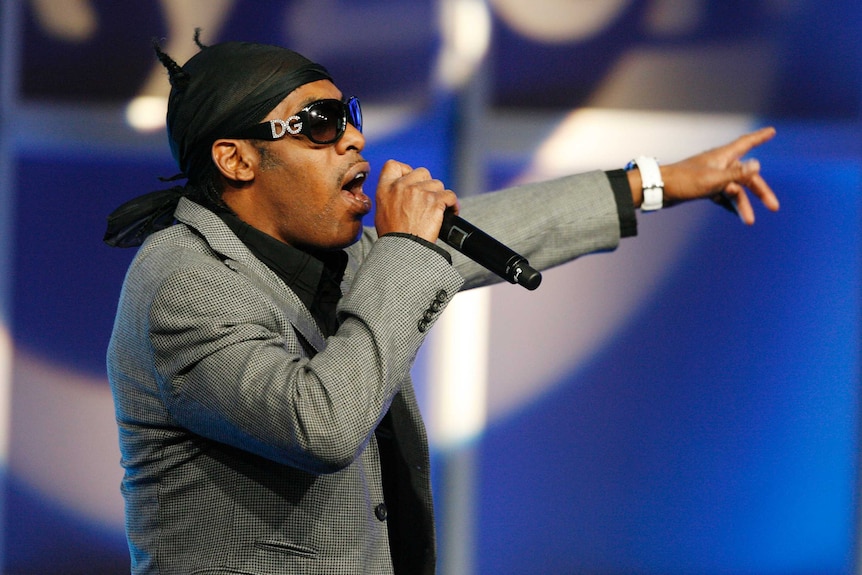 Singer Coolio performs before a panel discussion