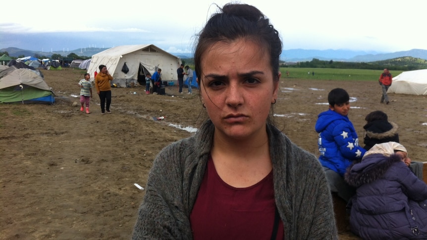 Rania Ali standing in the Idomeni refugee camp on the Greek-Macedonian border.