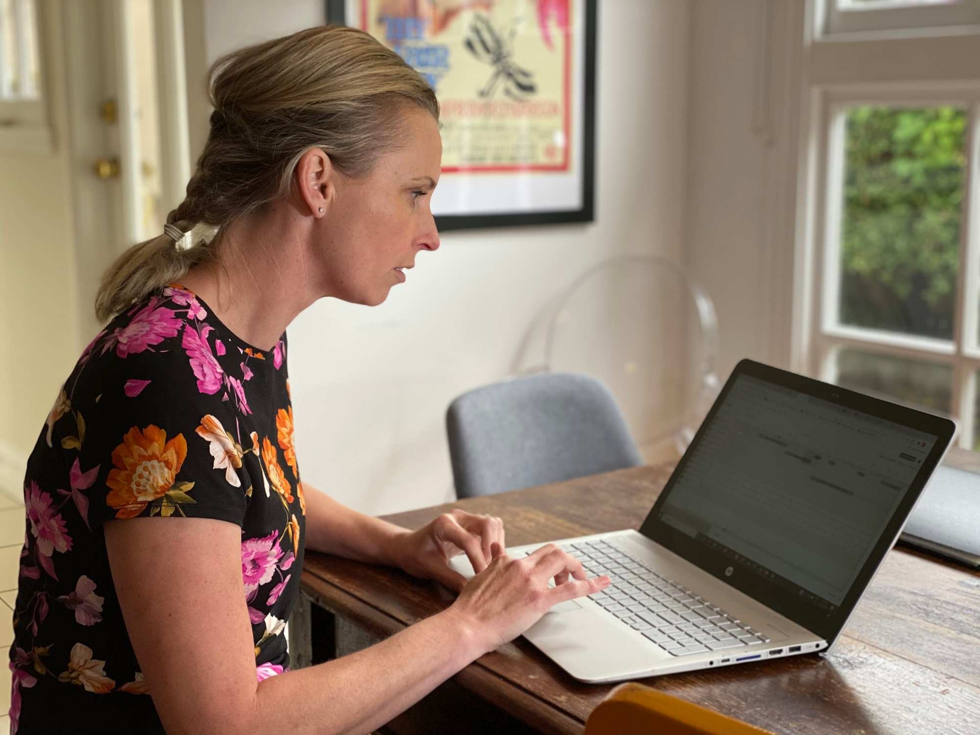 Tasmanian home-owner Louise Elliott works at her laptop.