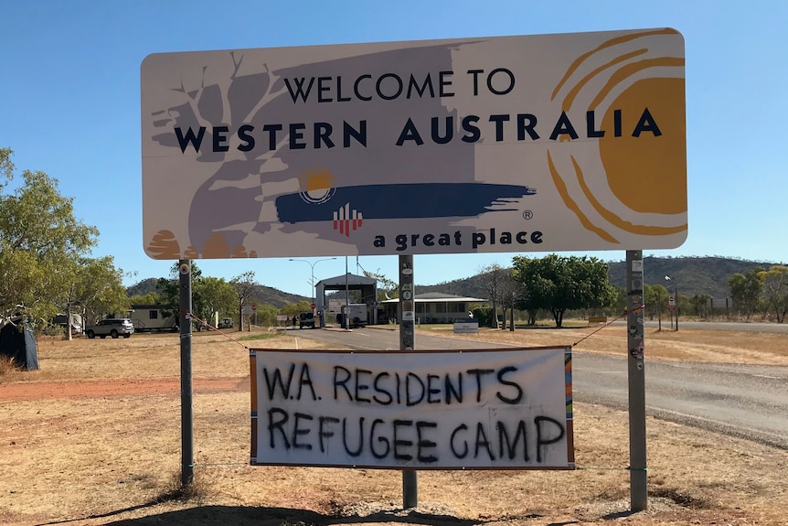 A sign on the border saying 'WA residents refugee camp'