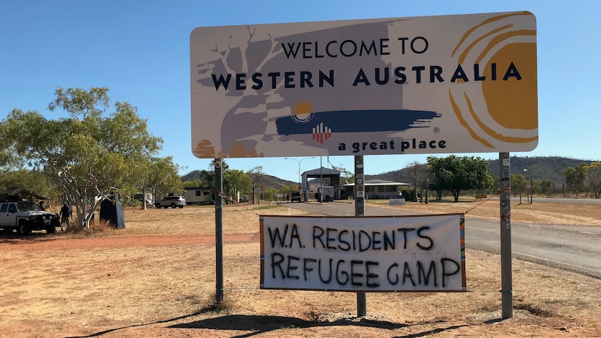 A sign on the border saying 'WA residents refugee camp'