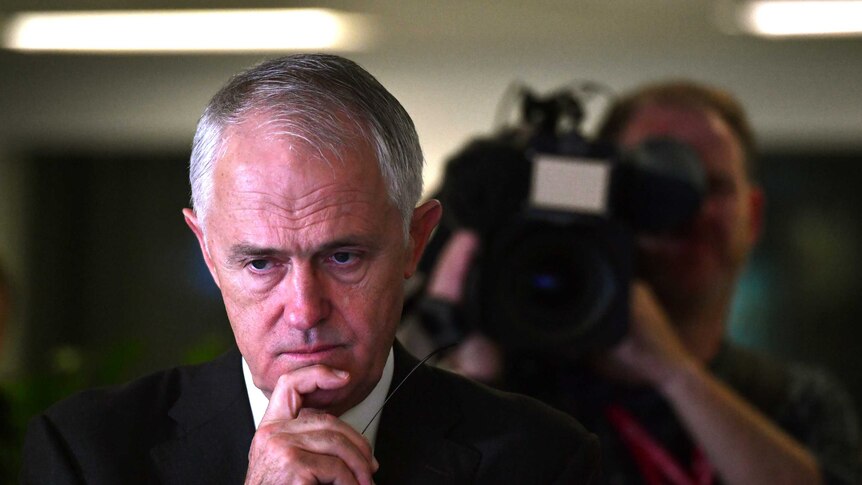 Prime Minister Malcolm Turnbull looks concerned as he inspects the relief effort