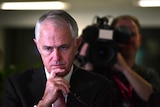 Prime Minister Malcolm Turnbull looks concerned as he inspects the relief effort