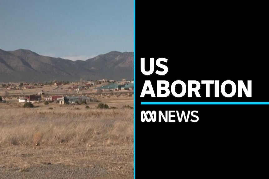 US Abortion: Landscape of a desert town in New Mexico with mountains in the background