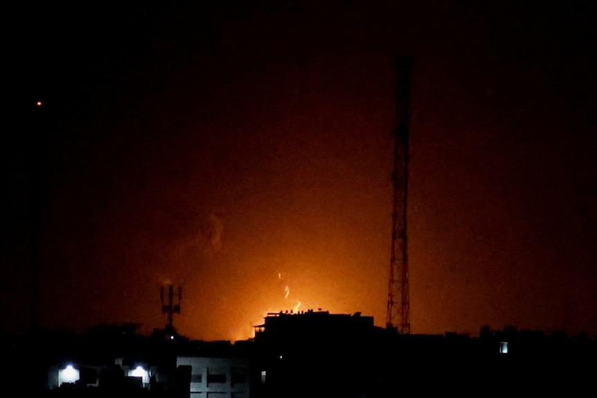 Smoke and flames rise during Israeli airstrikes in Gaza City.